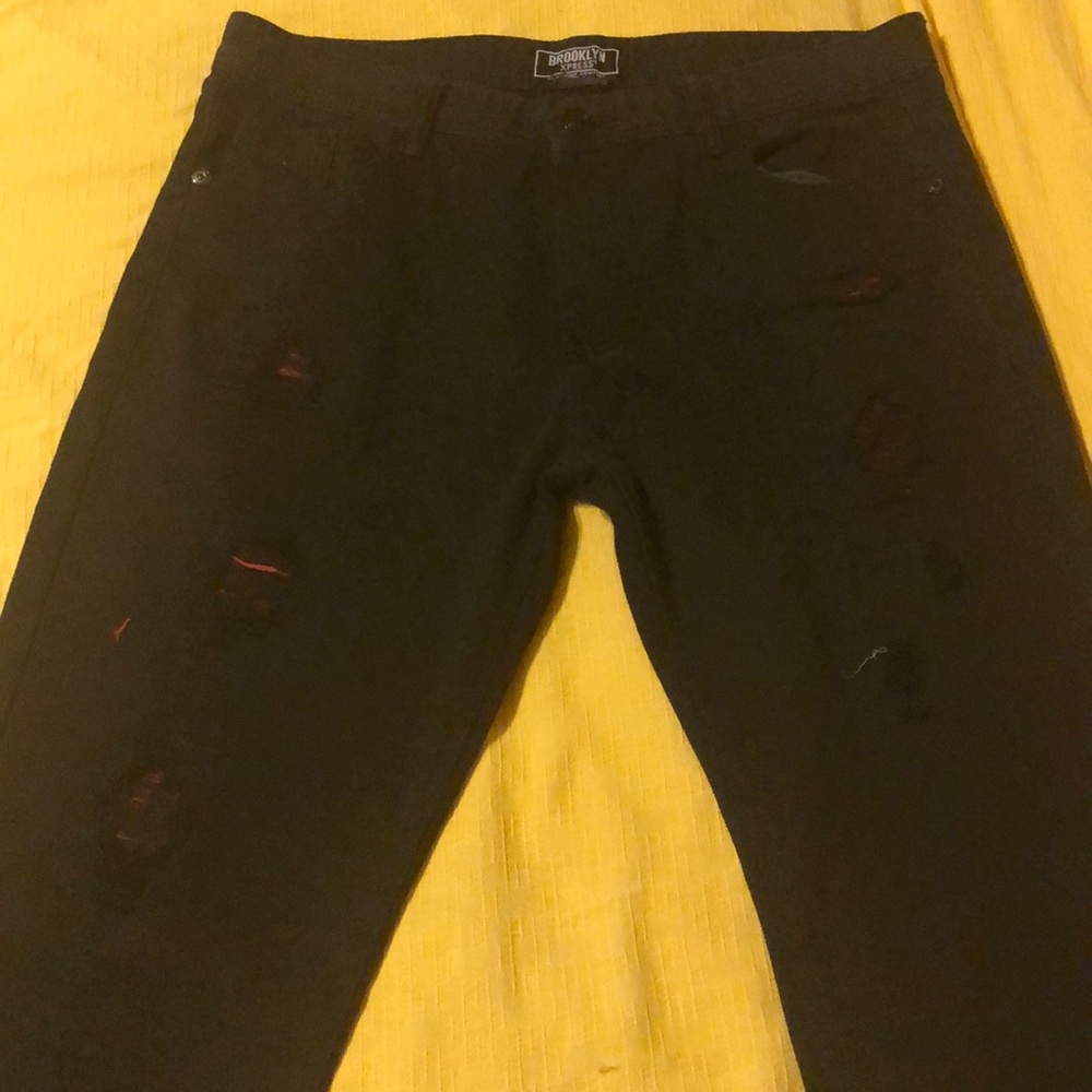 Brooklyn xpress black pants with red holes. 36